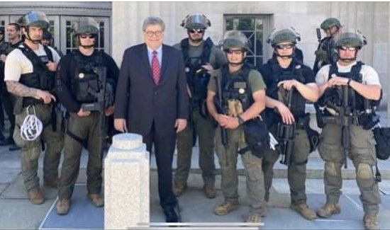 In a photo obtained by the Huffington Post's Ryan Reilly, Attorney General Bill Barr poses with a BOP SORT team outside the Justice Department's headquarters in Washington, D.C.